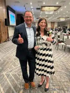 Image of Freese and Nichols Practice Leaders David Jackson, left and Jessica Brown, right at the Zachry Department of Civil and Environmental Engineering Distinguished Graduate Award Banquet in College Station. 