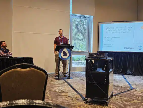 Image of JCWSA leaders, Authority Manager Joey Leslie, PE, Registered Land Surveyor (RLS), and Senior Engineer Nathan Hester, PE, RLS presenting the JCWSA water and wastewater master plan at the 2024 GAWP Fall Conference.