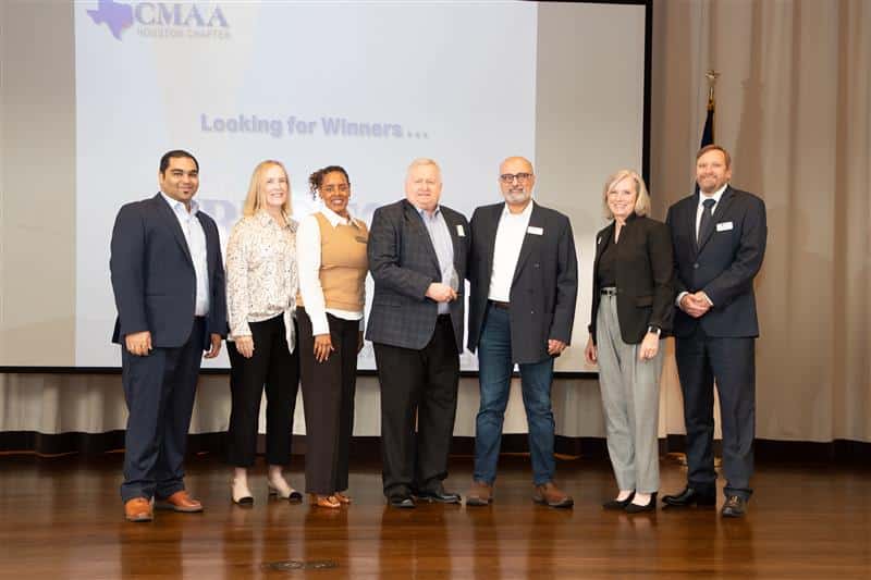 An image of the 2024 Construction Manager of the Year Michael Kennedy (center), with leadership members from the Construction Management Association of America (CMAA) Houston chapter. 